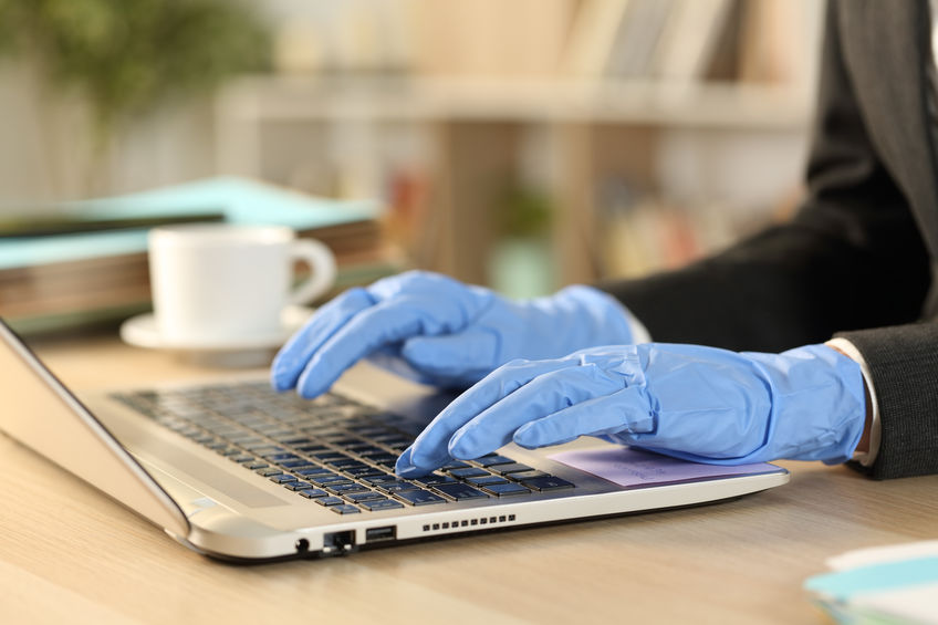 Freelance hands with defective latex gloves working